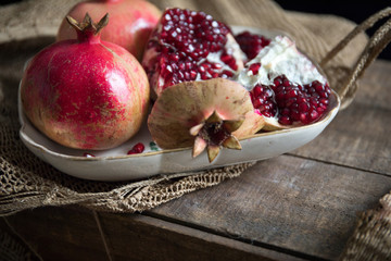 Pomegranate fruit arranged on wooden table top