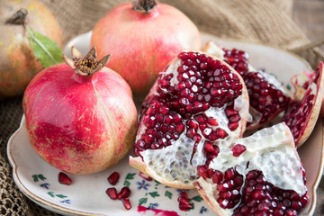 Pomegranate Fruit Arranged in Rustic Old Dish