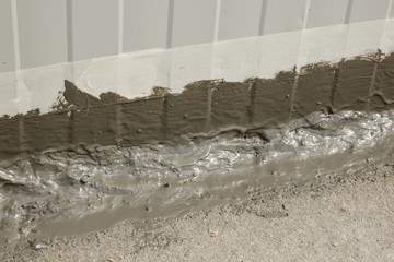 Waterproofing ms polymer sealant applied on an outside wall-floor connection