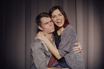 Happy couple in love in a photo booth