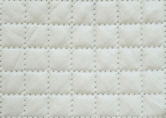 Closeup surface fabric pattern at the old white fabric oven glove for cooking isolated on white background