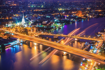 Fototapeta na wymiar Bangkok city skyline and Chao Phraya River under twilight evening sky.