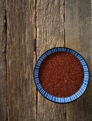 red quonoa on wooden surface