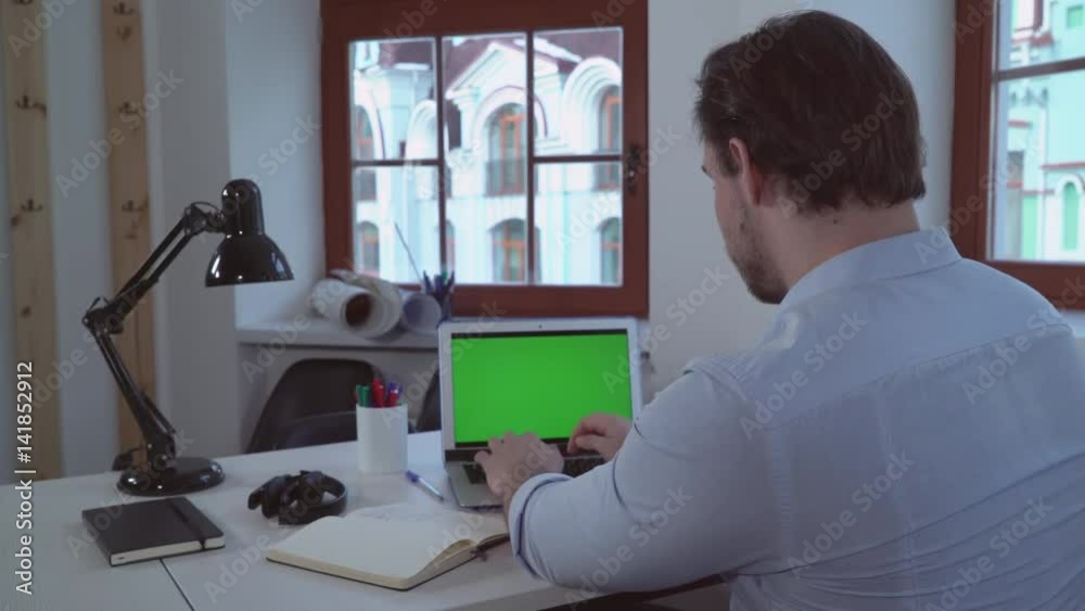 Aufkleber adult man working with computer in the office. businessman sitting at the work place alone near with