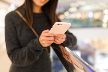 Woman working on mobile phone