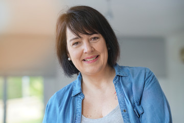 Portrait of smiling 50-year-old woman