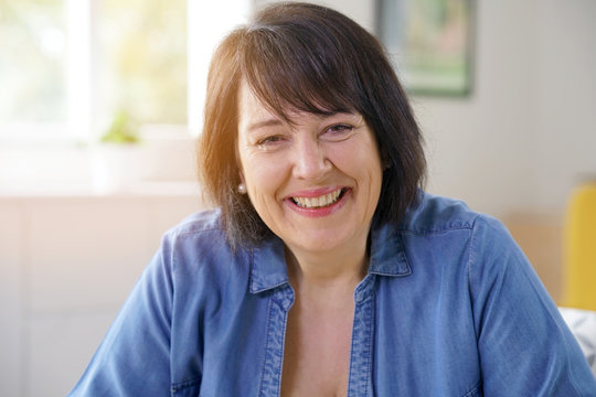 Portrait of smiling 50-year-old woman