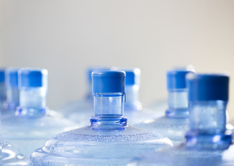Closeup of big empty bottle of water waiting for recycling