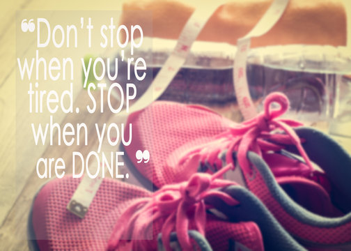 Inspirational quote on sneakers, towel, water and tape measure background
