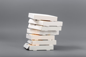 Pizza boxes on a gray background. Isolate