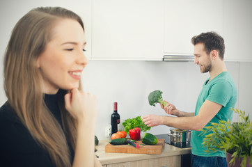 Young couple spends time together in the kitchen.