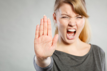 Screaming woman making gesture.