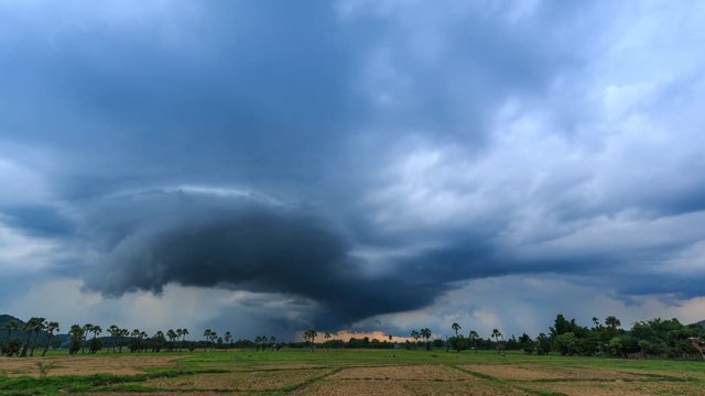 Time Lapse Nimbus Couds Floating And Raining Over Rural Field