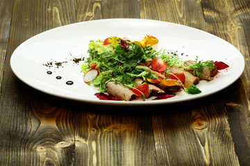 Green salad with baked meat