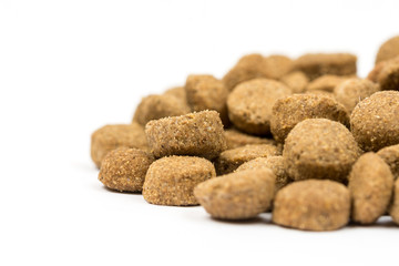 Dog and cat food granules isolated over white background