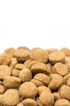 Dog and cat food granules isolated over white background