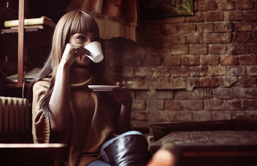 Obraz na płótnie Canvas Woman enjoying in coffee.