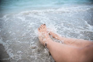 Fototapeten Cleaning Dirty Feet with a Splash  © Joseph