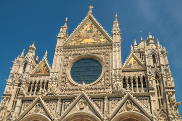 Naklejka premium Siena Cathedral is a medieval structure completed in the 13 century and is currently dedicated to the Assumption of Mary
