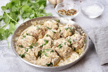 Dinner with meatballs in white sauce