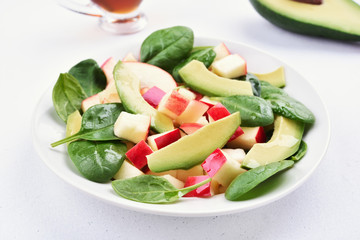 Green salad with apples, avocado, spinach