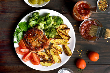 Barbecue pork with vegetables on plate