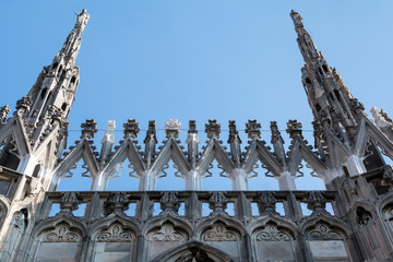 Facade of Milano cathedral famous for its numerous statues on steeples, Milano, Italy.