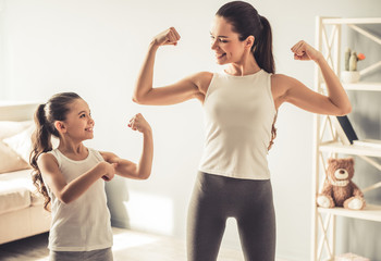 Mom and daughter working out