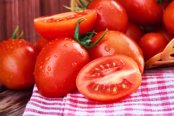 Close-up of fresh ripe cherry tomatoes on wooden background