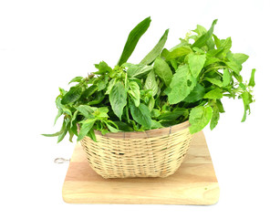 Naklejka premium Vegetables in the basket, isolated on white