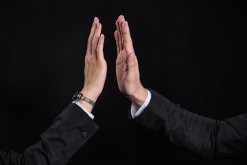 Businesspeople giving high five