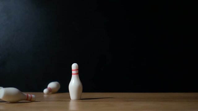 Super slow motion footage with falling skittles with bowling ball.