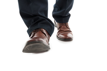 Close-up of business man elegant shoes walking