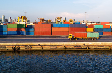 container ship in import export and business logistic.By crane ,Trade Port , Shipping.cargo to...
