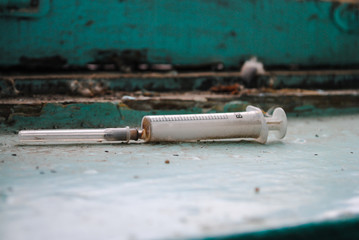Syringe in the entrance of the house
