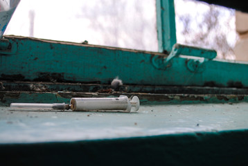 Syringe in the entrance of the house