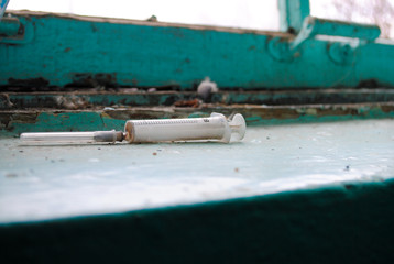 Syringe in the entrance of the house