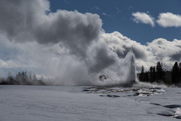 Old Faithful, The famous geyser attraction in Yellowstone known for its hot-water eruptions on a consistent schedule