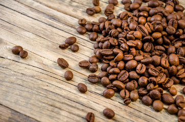 Roasted Coffee beans on natural wooden background
