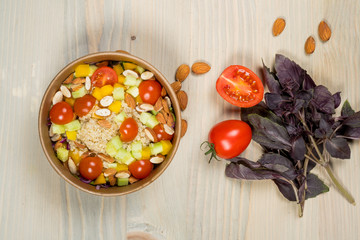 Detox salad for vegetarian, vegan food, vitamin snack and health life. Top horizontal view on light wood background and copy space. White overhead flat food photo. 