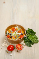 Detox salad for vegetarian, vegan food, vitamin snack and health life. Top horizontal view on light wood background and copy space. White overhead flat food photo. 