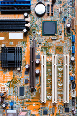 A mainboard ( Main board,cpu motherboard,logic board,system board or mobo board)
close up of electronics circuit board 
