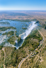 The Victoria falls is the largest curtain of water in the world (1708 m wide). The falls and the surrounding area is the National Parks and World Heritage Site (helicopter view) - Zambia, Zimbabwe - 141868596