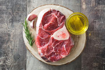 Raw meat on wooden background
