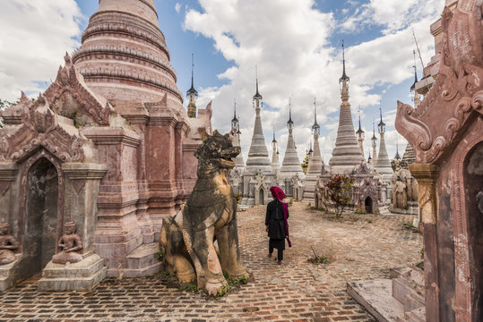 Kakku, Taunggyi, Shan State, Myanmar (Birmania). A woman walking between the 2478 stupas.