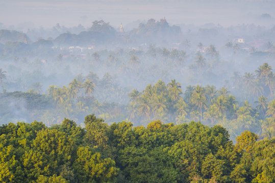 Mrauk-U, Rakhine state, Myanmar. Mrauk-U valley in a foggy sunrise seen from the Shwetaung pagoda.