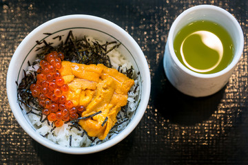 Japanese dish of salmon roe and urchin eggs with rice