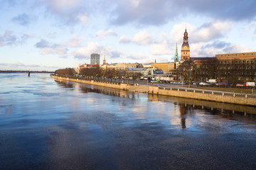 Fototapeta na wymiar Sunset light over bridge and river in Riga, Latvia