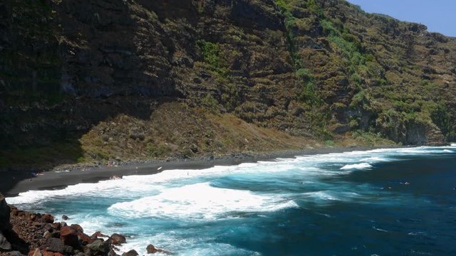 Panoramic view of the shore of Nogales beach, with many waves and strong wind, on the island of La Palma, Canary Islands, Spain.