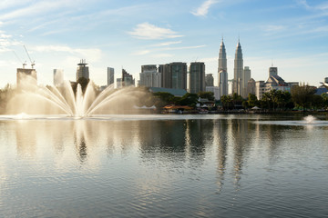 Fototapeta na wymiar Kuala Lumpur skyline and fountation at Titiwangsa Park in Kuala Lumpur. Malaysia.